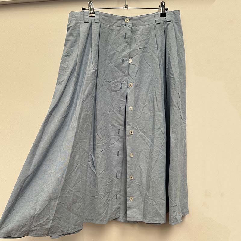wholesale job lot of midi and knee length skirts - blue buttoned skirt, example of what you might receive