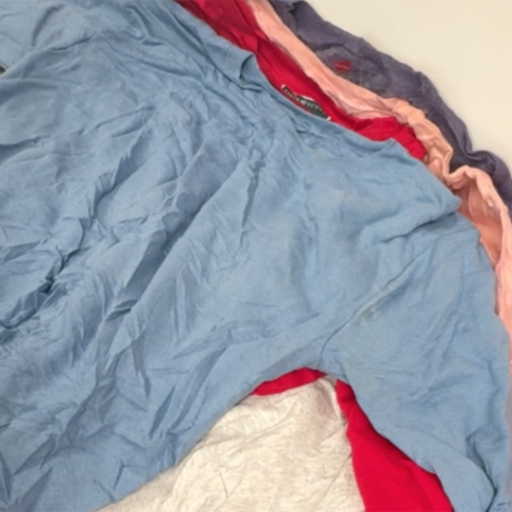 Unboxing a 45kg wholesale bale of plain sweatshirts featuring assorted vintage and modern styles, colours, and brands.