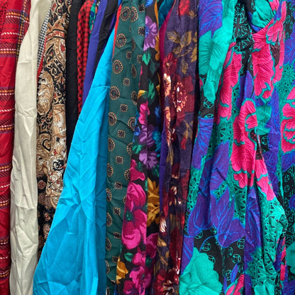 Wholesale vintage and secondhand mixed bundles of ladies dresses in a range of colours, prints, styles, brands and sizes.  Choose from Grade A, B or ungraded to bulk buy per kilo, piece or bale. Handpick available in Sussex.