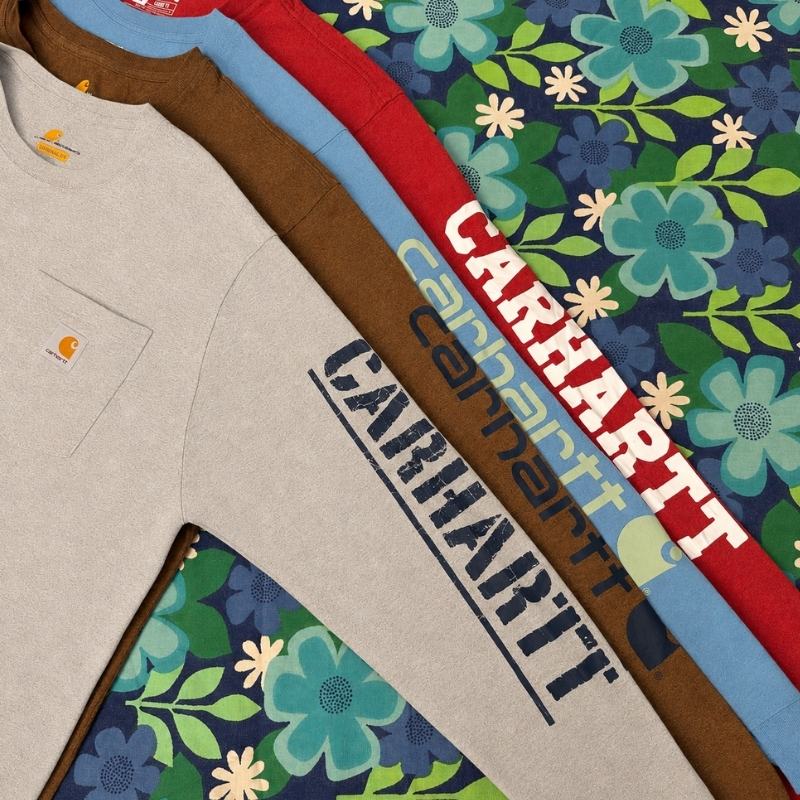 three different coloured carhartt long sleeve t-shirts in a floral background