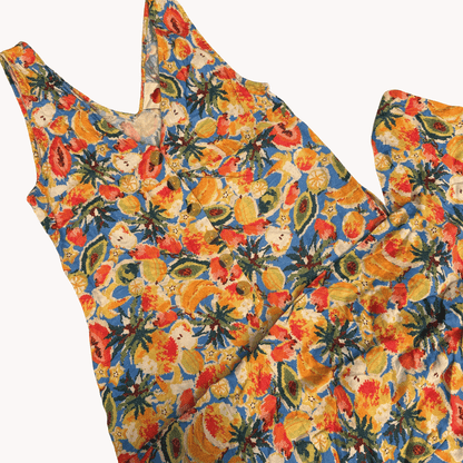 Colorful floral patterned fabric jumpsuit on a white background
