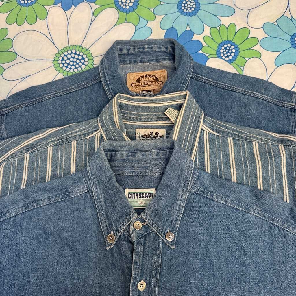 three denim shirts on a flowery background