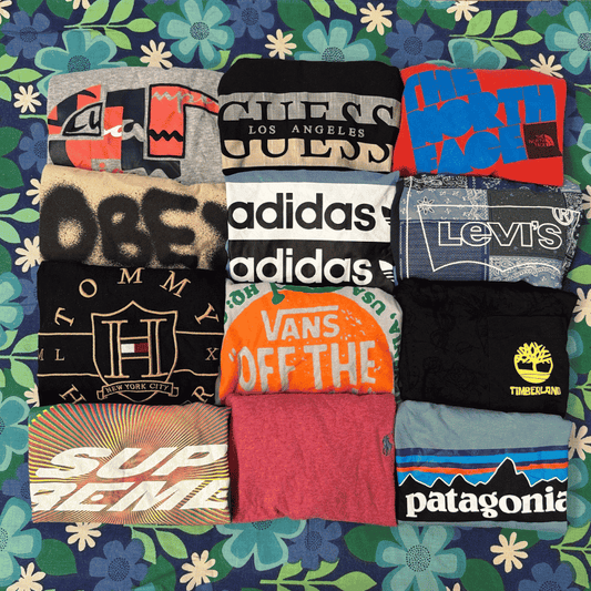 Collection of various branded t-shirts on a floral background