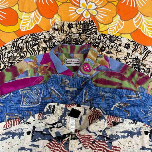 Collection of colorful patterned shirts with visible brand labels on a floral background.