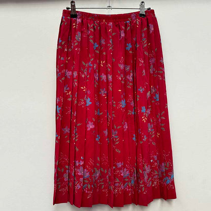 wholesale job lot of midi and knee length skirts - red pleated skirt, example of what you might receive
