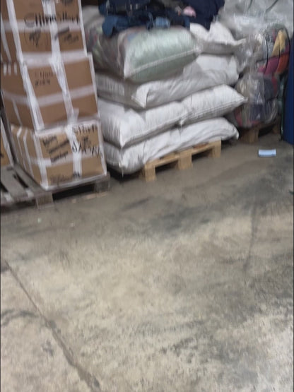 Unboxing a 45kg bale of vintage 1980s dresses – wholesale women's fashion for resale including classic styles, bold prints, and iconic silhouettes.