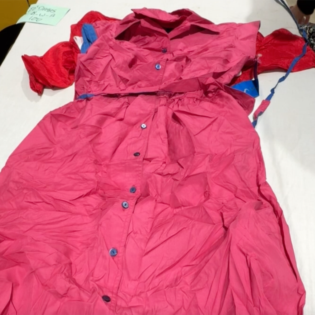 Unboxing a 45kg bale of vintage 1980s dresses – wholesale women's fashion for resale including classic styles, bold prints, and iconic silhouettes.