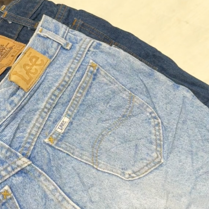 Unboxing a vintage wholesale jeans bale: showcasing assorted denim styles for men and women including branded and unbranded second hand jeans.