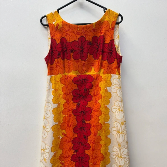 Unboxing a 45kg wholesale bale of vintage Hawaiian dresses for women – assorted tropical prints, summer styles, and bold colours.