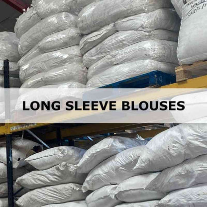 Stacks of white bags labeled 'Long Sleeve Blouses' in a warehouse setting.